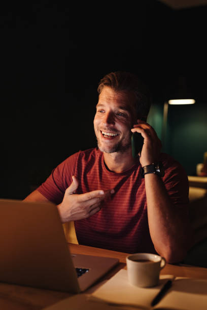 istock Smiling Businessman Working at Home at Night 1363227304