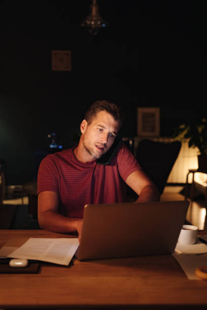 istock Serious Businessman Working at Home at Night 1363227305