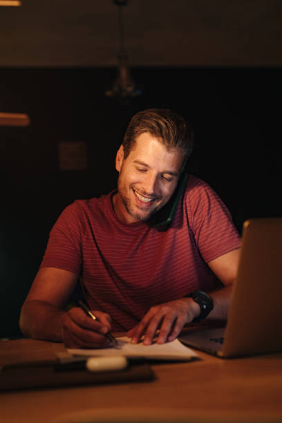 istock Happy Businessman Working at Home at Night 1363227311
