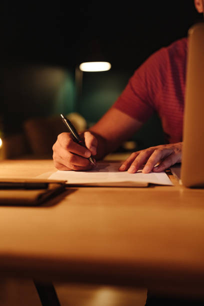 istock An Anonymous Businessman Working at Home at Night 1363227313