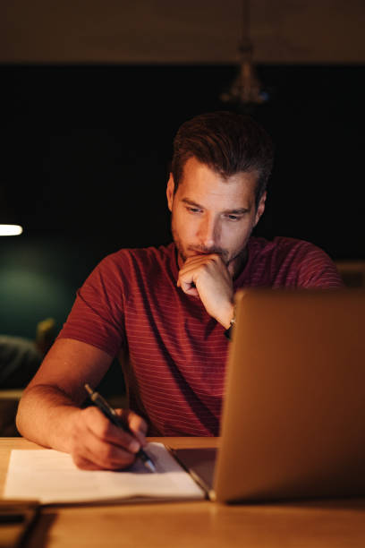 istock Serious Businessman Working at Home at Night 1363227318