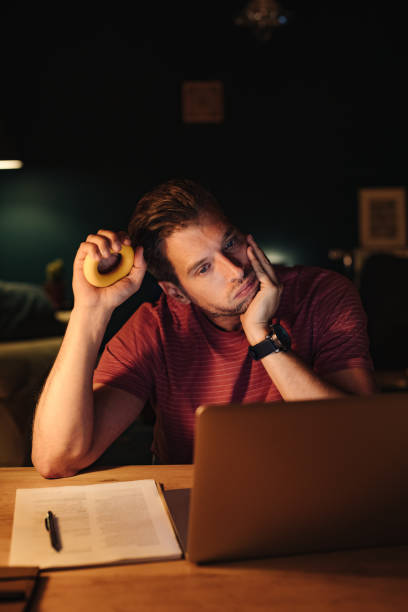 istock Tired Businessman Working at Home at Night 1363227326
