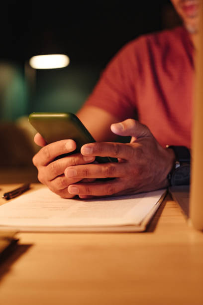 istock An Anonymous Businessman Working at Home at Night 1363227333