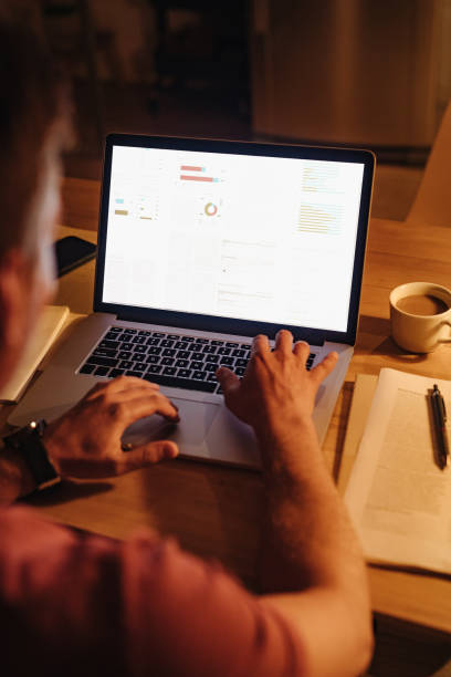istock An Anonymous Businessman Working at Home at Night 1363227351
