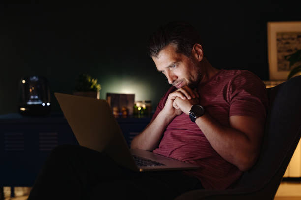 istock Serious Businessman Working at Home at Night 1363227372