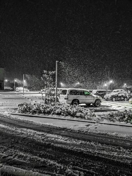 snowy landscape of the parking lot. - street light parking lot night lot imagens e fotografias de stock