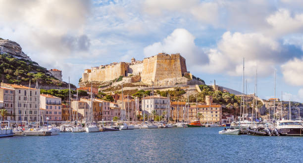 Landscape with Bonifacio town in Corsica Landscape with Bonifacio harbor and town in Corsica island, France bonifacio stock pictures, royalty-free photos & images