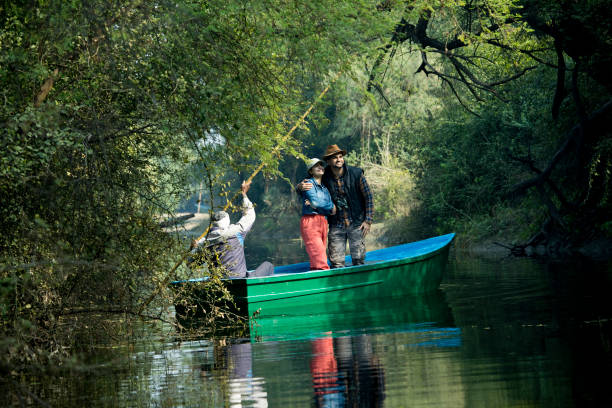 istock Couple admiring view while riding on boat 1363229203