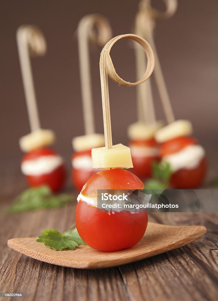 cherry tomato with cheese buffet food,cherry tomato stuffed with cheese Appetizer Stock Photo