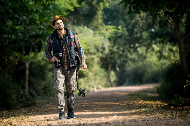 istock Male hiker admiring nature in forest 1363230035