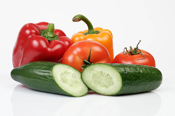 Cucumbers, tomatos and peppers stock photo