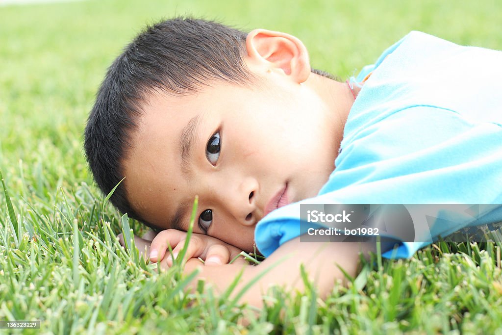 sad boy a boy on the grassland , feel sad 4-5 Years Stock Photo