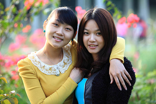 istock Two female friends smiling togetherness 136323372