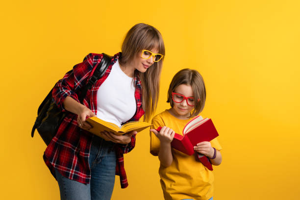 Mom and daughter study together stock photo