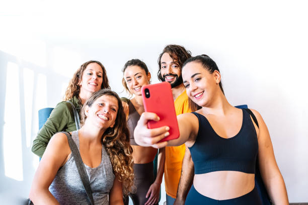 istock Cheerful group taking selfie in yoga studio 1363235695