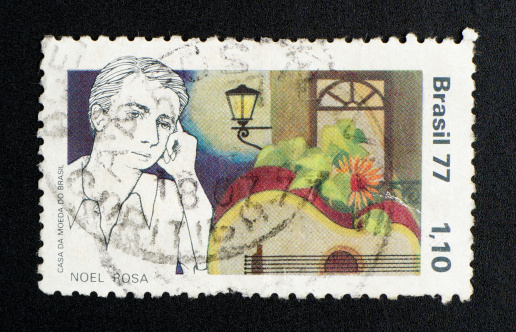 brazilian postage stamp, on black background. studio shot. 1977.