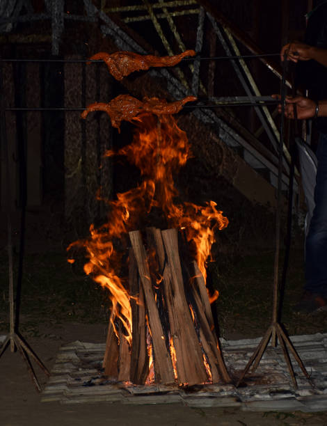 istock Chicken being barbecued over bonfire 1363237712
