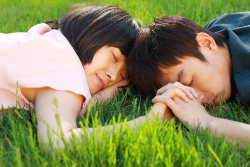 young asian lover on the grassland