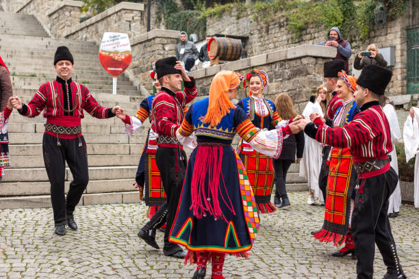Plovdiv, Bulgaria, Young wine parade in the Old Town Plovdiv, Bulgaria - November 26, 2021: Young wine parade in the Old Town, traditional folklore dances bulgarian culture photos stock pictures, royalty-free photos & images
