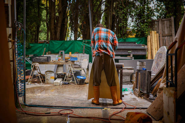 istock Rear view of unreconizable stonecutter, with a sander tool, making this marble stone shiny 1363245434