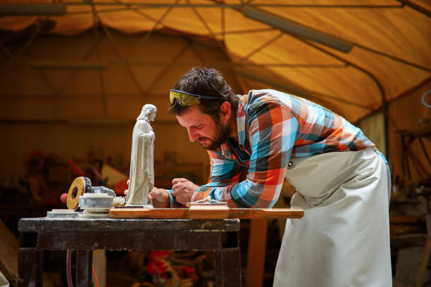istock At his workshop, male sculptor, carving a statue from the stone 1363246072