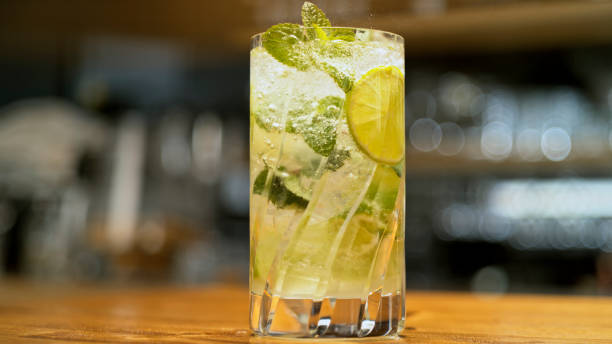 istock Cocktail on table with lemon and mint leaves 1363246556
