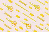 Pattern of Yellow highlighter, pens and stationary on pink Background