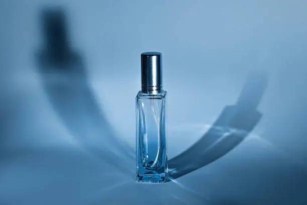 unbranded transparent perfume glass sprayer minimal style concept. flacon of essence perfume for your text and design