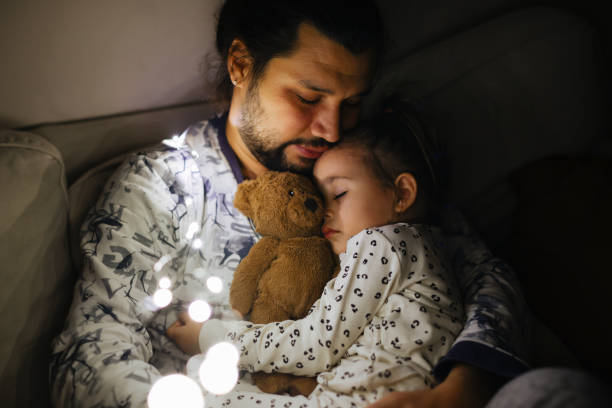 istock Young father and daughter taking a nap together 1363259519