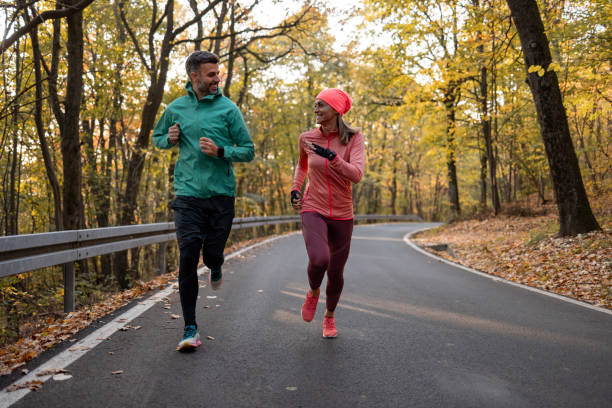 istock Happy Caucasian couple jogging in nature 1363259747