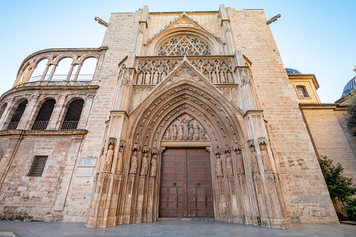 Door of the Apostles at Metropolitan Cathedral–Basilica of the Assumption of Our Lady on Plaza de la Almoina in Valencia, Spain