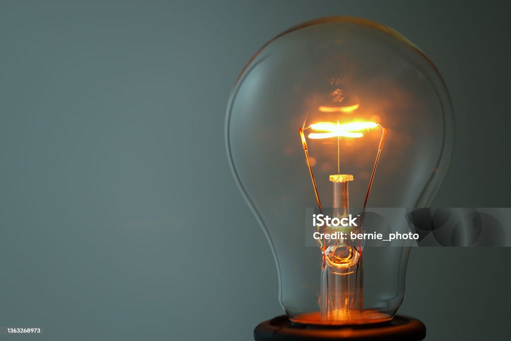 Close up glowing light bulb Lightbulb Close-up and Copy space Light Bulb Stock Photo