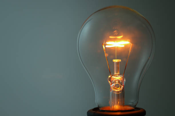 Close up glowing light bulb stock photo