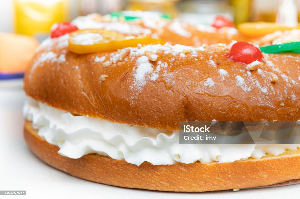 Roscon de Reyes, traditional cake in spanish christmas with candied fruits and whipped cream Roscón de reyes Almond Stock Photo