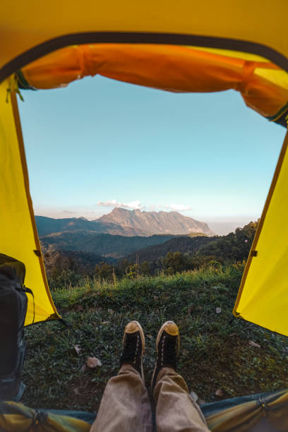 istock Yellow tent on the mountain and sunset view 1363270714