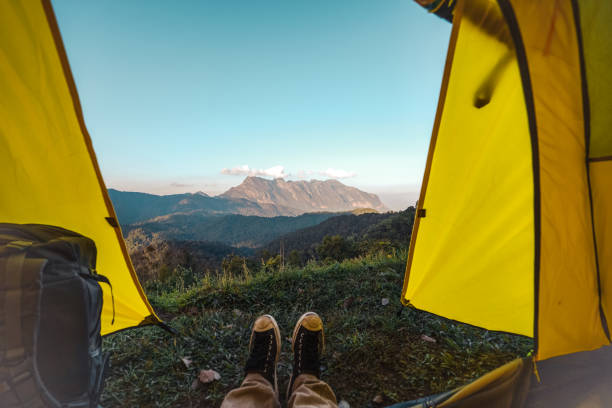 istock Yellow tent on the mountain and sunset view 1363270765
