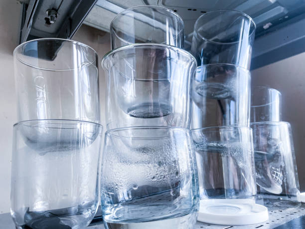 istock Drinking glasses with water drops put one on another 1363273576