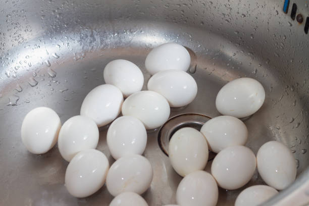 istock Wash chicken eggs in the kitchen sink with soap and water before cooking eggs 1363274670