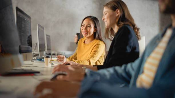 istock Smart Young Students Studying in University with Diverse Multiethnic Classmates. Scholars Collaborate in College Room with Computers. Applying Knowledge to Acquire Academic Skills in Class. 1363276349