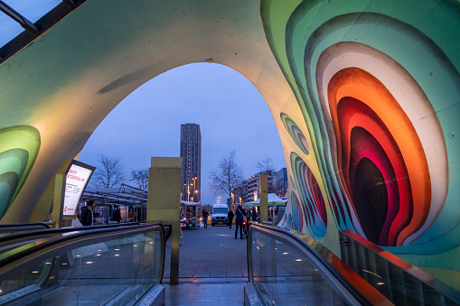 Eindhoven Netherlands on December 14, 2021: cityscape colorful tunnel with escalators to the bike parking at  main square.