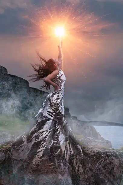 Photo of An artistic photo of a girl dressed in a foil dress