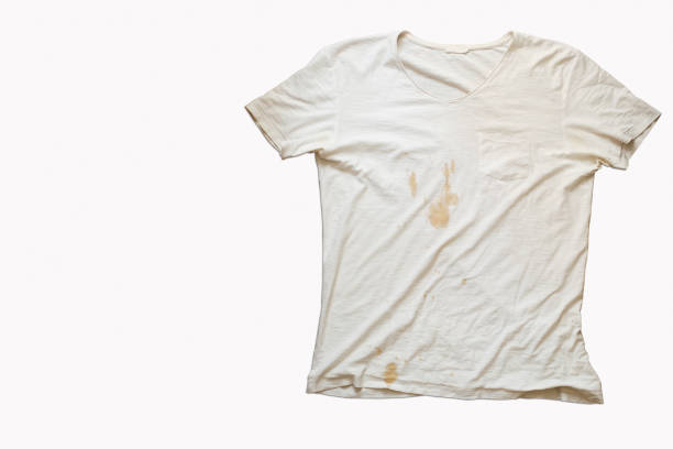 White t shirt with coffee stain and wrinkles White t shirt with coffee stain and wrinkles on a white background. wet wood texture stock pictures, royalty-free photos & images