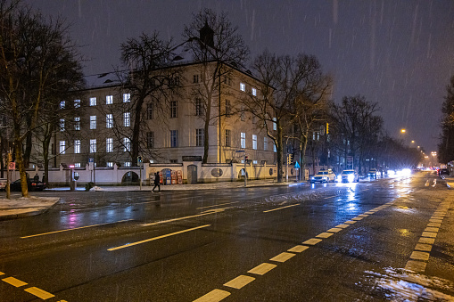 Street corner in a residential district on a rainy night in the center of the German city Munich which is the capital city in Bavaria