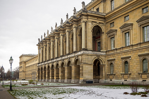 Façade of the Residenz palace on a cold and snowy day in the center of the German city Munich which is the capital city in Bavaria