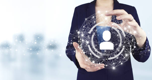 istock Social media concept. Communication network. Two hand holding virtual holographic Human, Leader icon with light blurred background. Customer profile in a mobile app. 1363279145