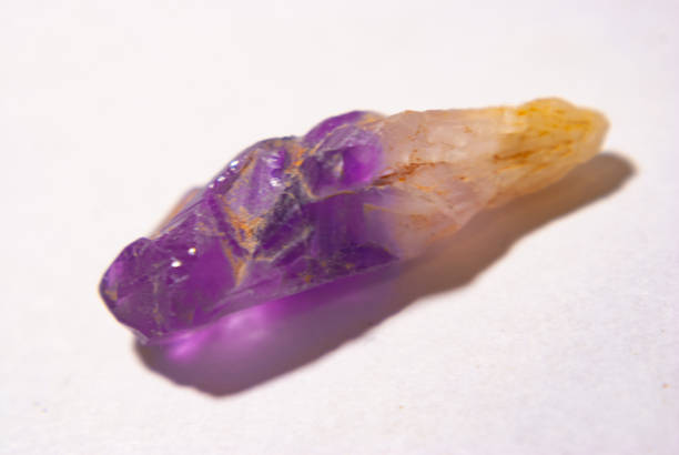 istock Purple amethyst quartz on a white background 1363282076
