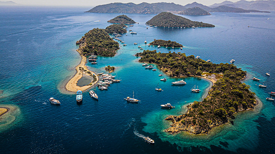istock aerial view of islands and boats, people swimming on island and turquoise water, boats docked around the island, vacation location, famous place for vacation, wonderful islands 1363283074