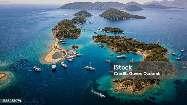 Aerial View Of Islands And Boats People Swimming On Island And Turquoise Water Boats Docked Around The Island Vacation Location Famous Place For Vacation Wonderful Islands Stock Photo - Download Image Now