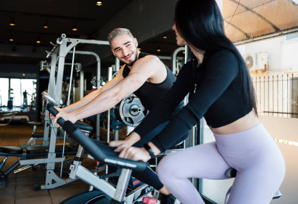 istock Man And Woman Doing Exercises In The Gym 1363284270