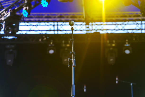 istock Stand with microphone on stage before the concert. 1363286346